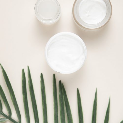 top-view-body-butter-cream-plain-background